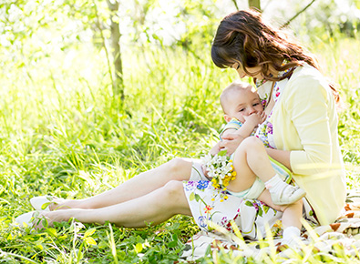 Women breastfeeding her child.